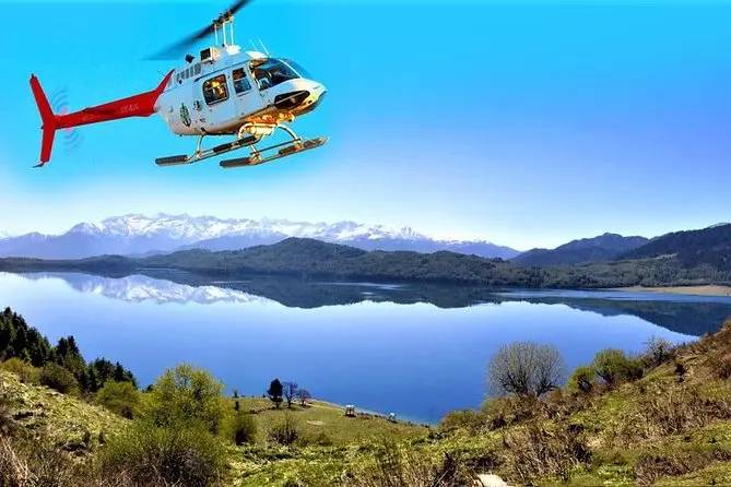 Rara lake helicopter tour with beautiful view of the lake and mountain in the back