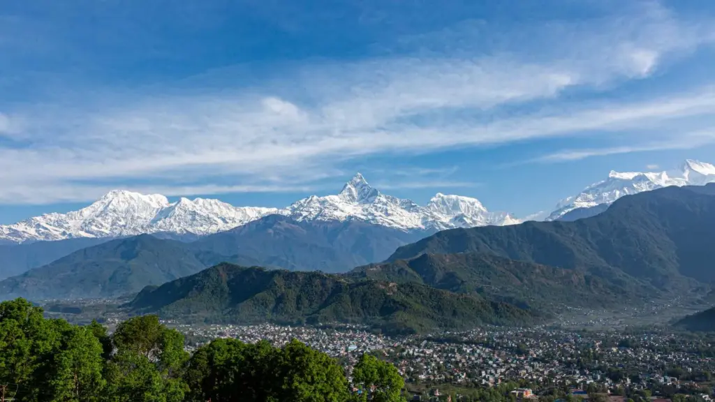 Pokhara city with Annapurna range and Machapuchare peak under clear sky during the best time to visit Nepal.